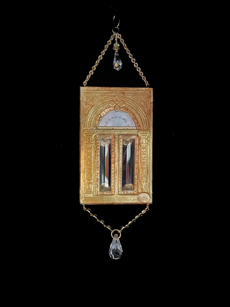 This door to dreams features antique lead crystals, Swarovski crystals, and a transom made from an antique Mother-of-Pearl gaming piece.