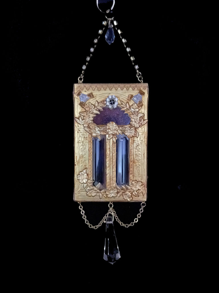 Peer into the heavens through the Blue Goldstone transom of this golden portal. Dangling crystals invite you to knock.