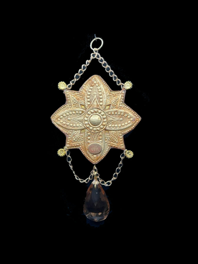 A tiny iridescent dragon is the center of attention on this lovely medallion. A champagne-colored crystal dangles at the bottom of the pendant.