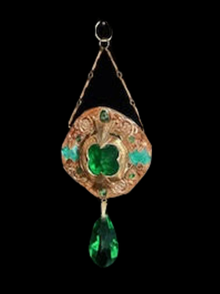 This medallion with a large Emerald green crystal as its center surely will inspire envy of its wearer.