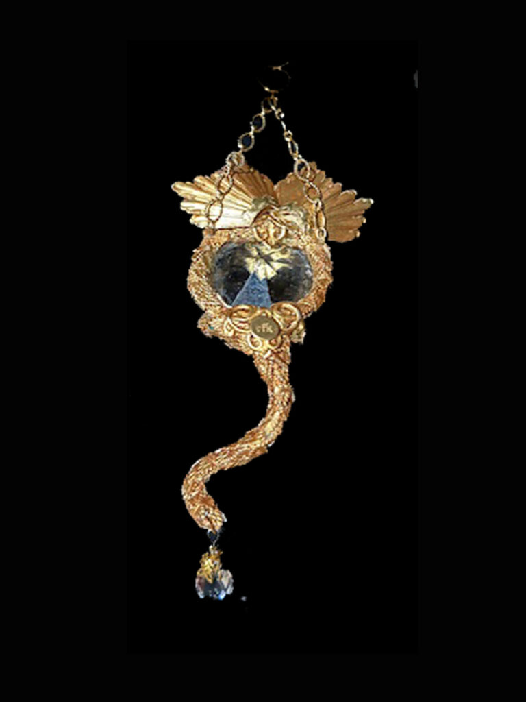 Dragon Pendant with a gold color and a clear crystal