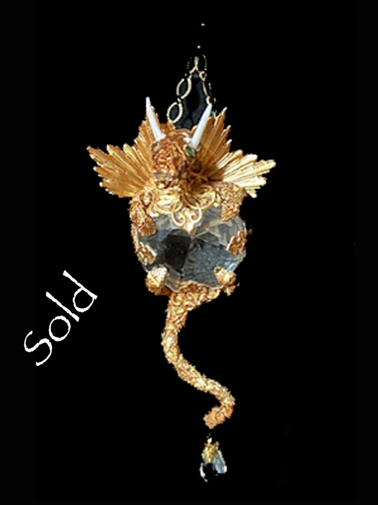 Dragon Pendant with a gold color and a clear crystal